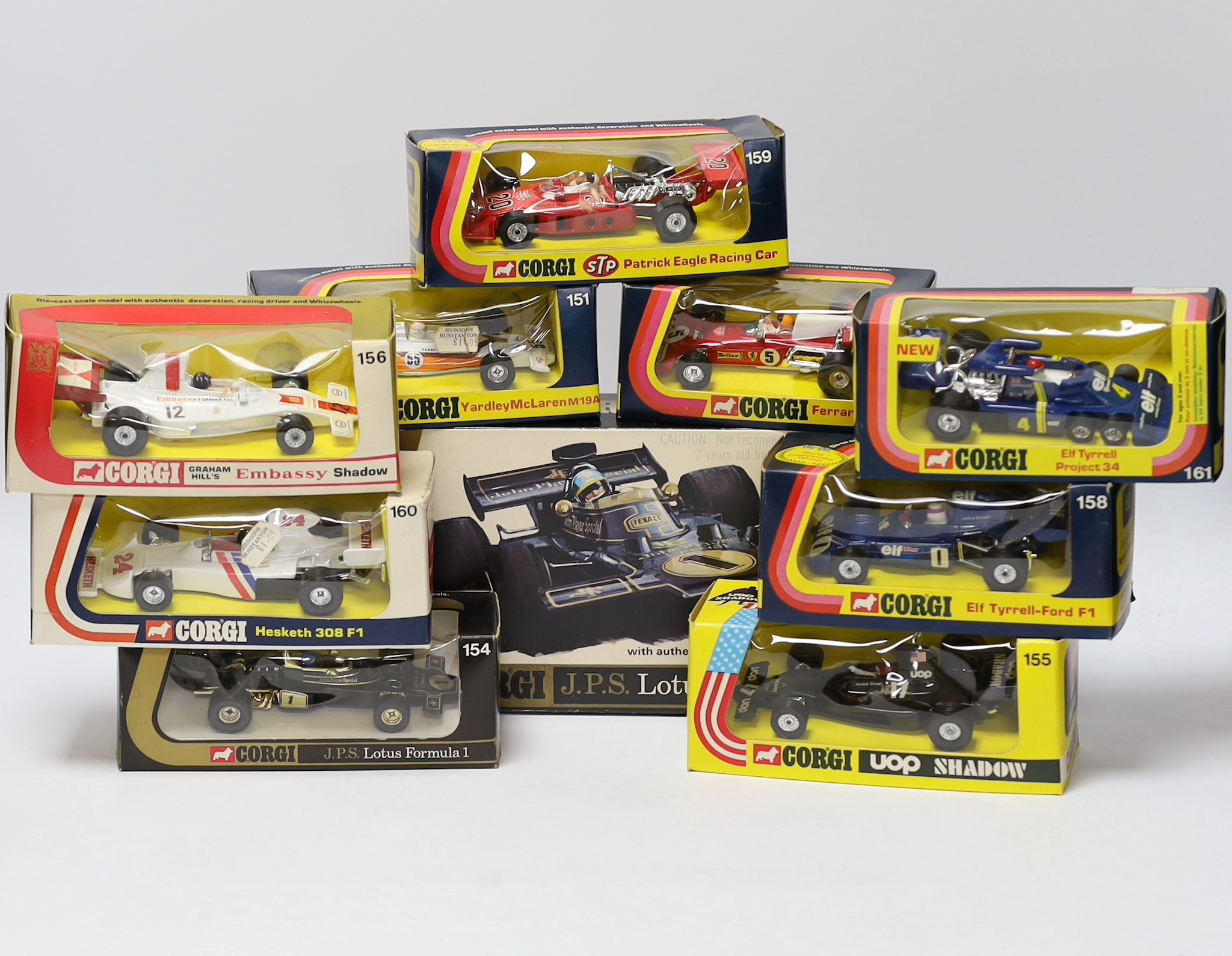 Ten boxed Corgi racing cars